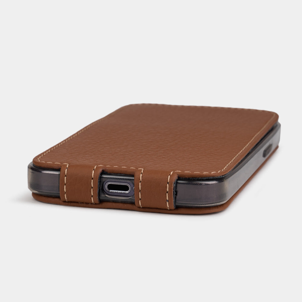 Gold calfskin leather flip case for iPhone 15 – bottom view with USB-C port opening and hand-stitched edges