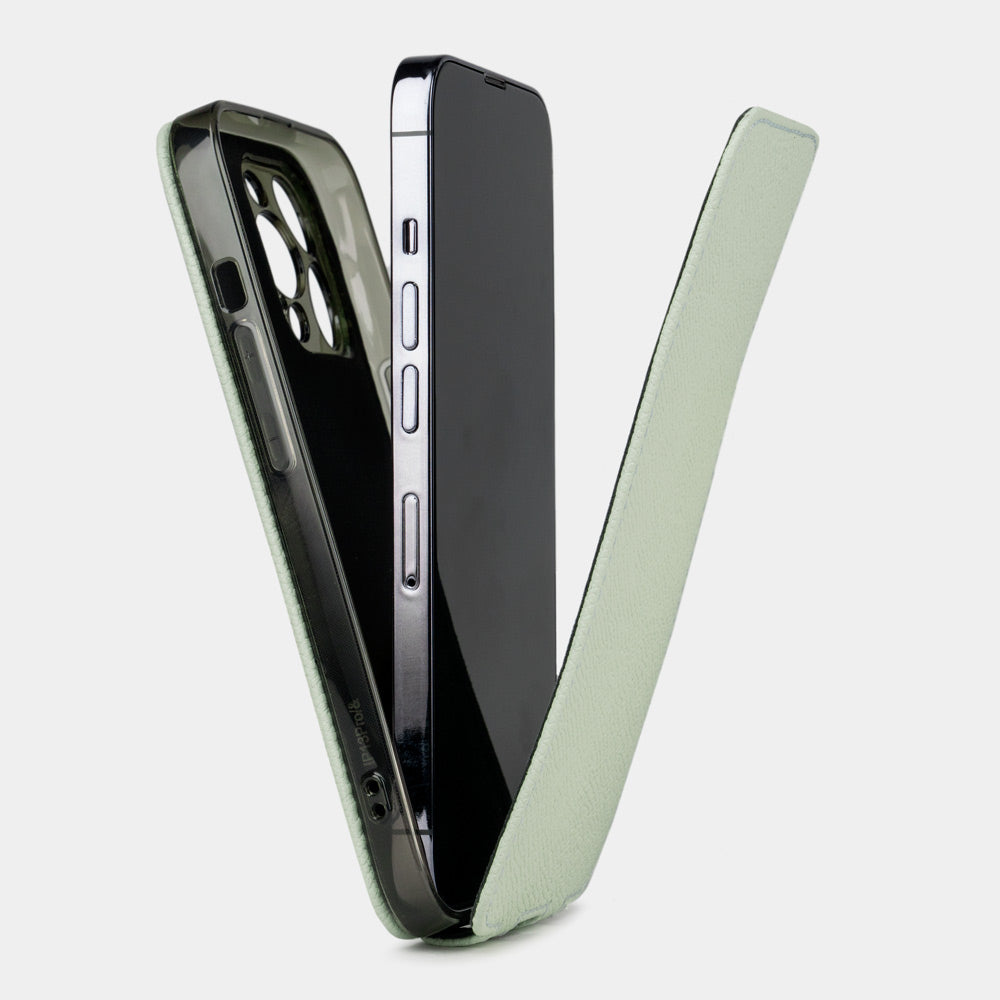 Pastel green calfskin leather flip case for iPhone 15 – case shown apart from the phone, how to install the phone into the slim shell and camera cutout visible