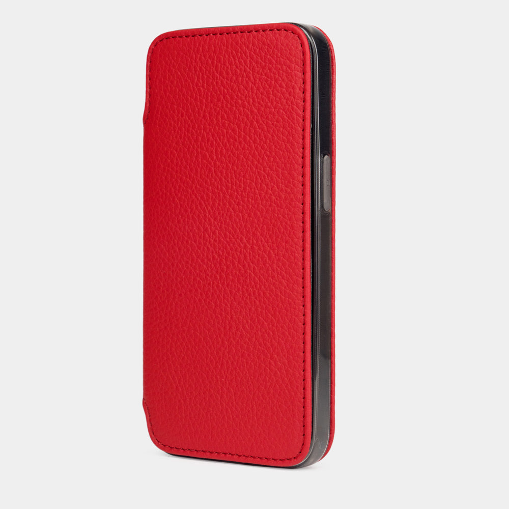 Red calfskin leather folio case for iPhone 15 Pro – folio closed, three-quarter front view showing the full-grain leather
