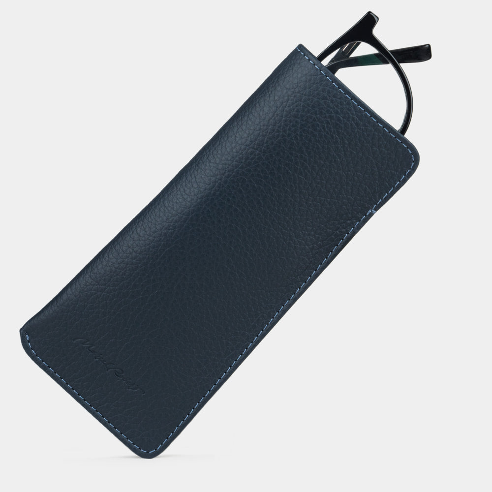 Pocket glasses pouch in blue calfskin with glasses slipping out of the top