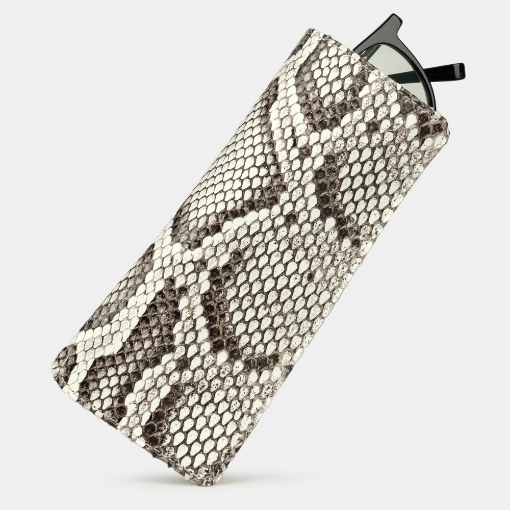 Pocket glasses pouch in natural python with glasses slipping out of the top