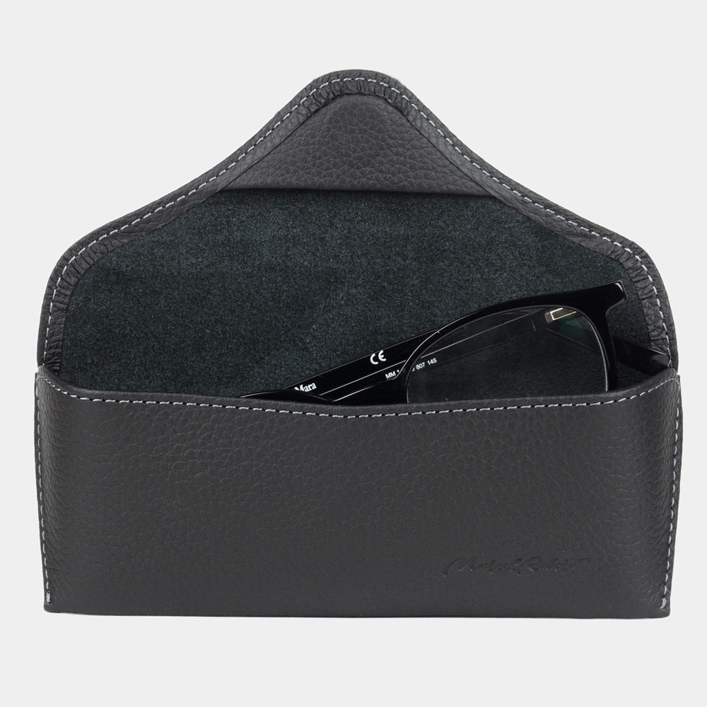 Casual glasses case in black calfskin, flap open with glasses inside