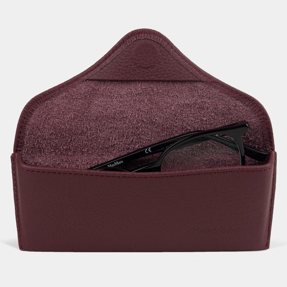 Casual glasses case in bordeaux calfskin, flap open with glasses inside