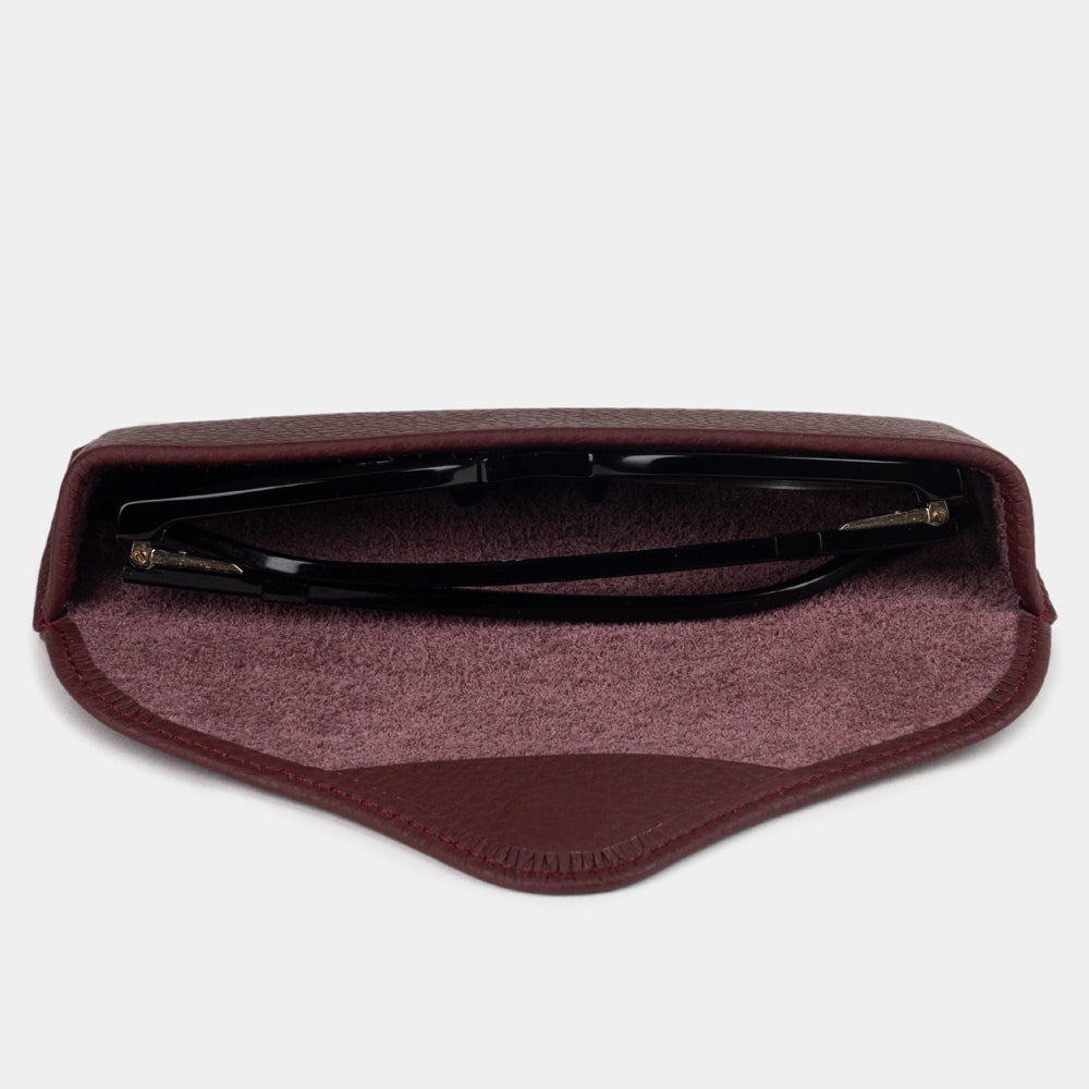 Bordeaux calfskin Casual case seen from above, glasses resting on the suede