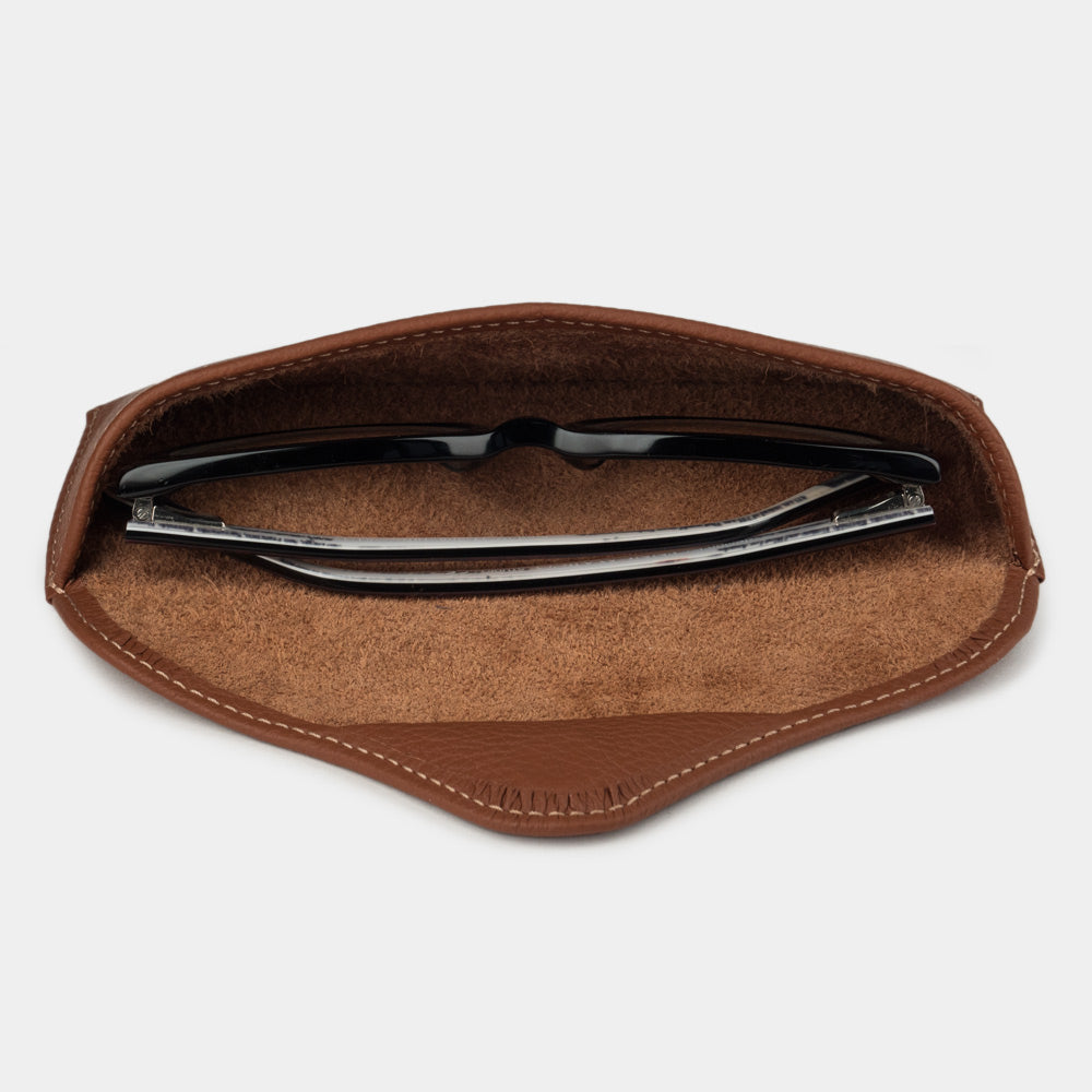 Gold calfskin Casual case seen from above, glasses resting on the suede