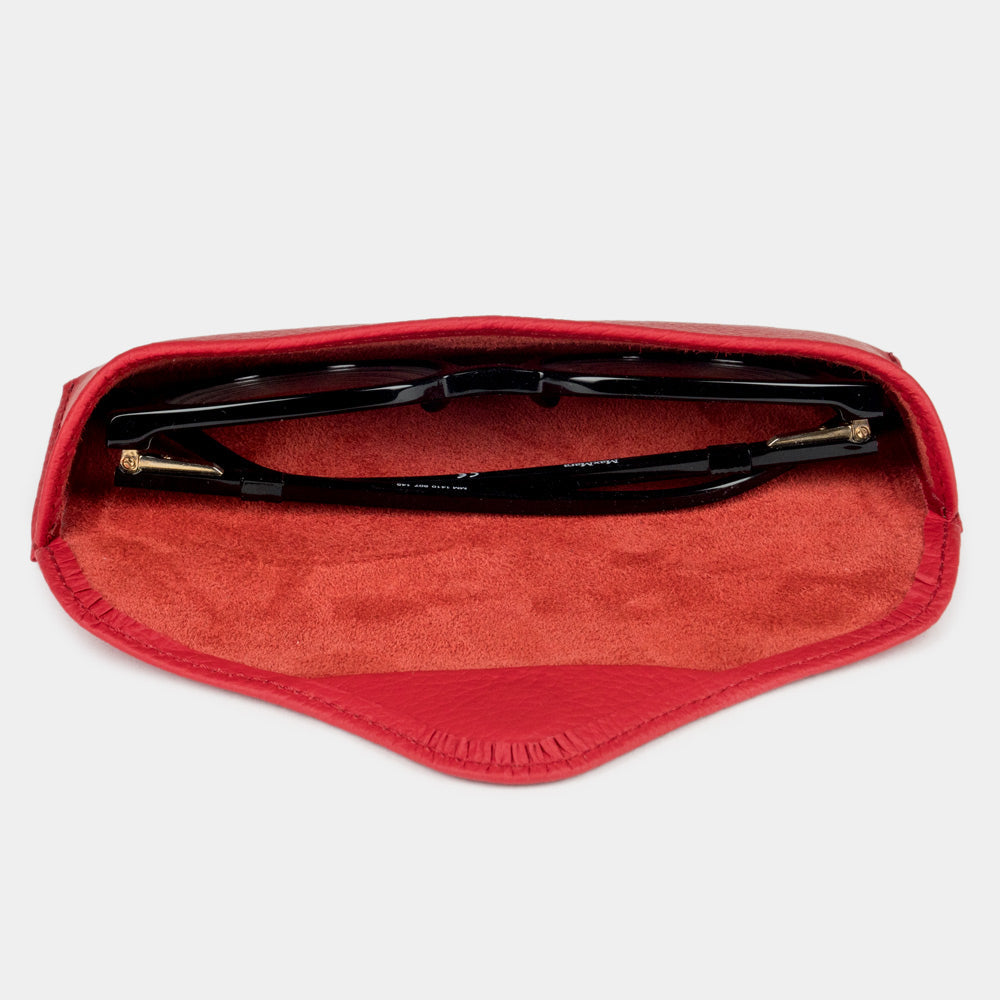 Red calfskin Casual case seen from above, glasses resting on the suede