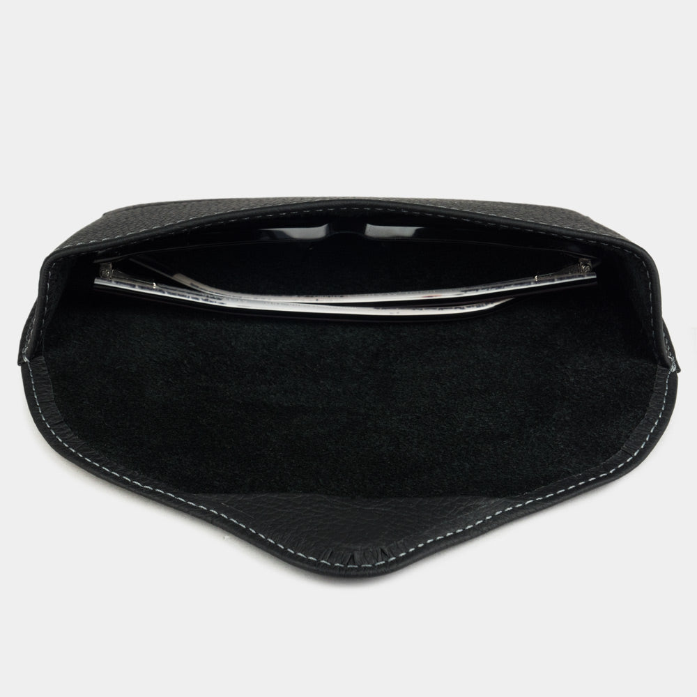 Black calfskin Riviera case seen from above, sunglasses resting on the suede