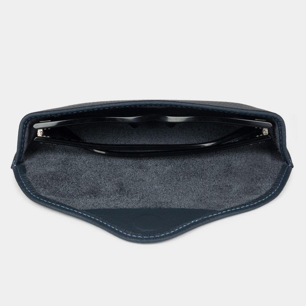 Blue calfskin Riviera case seen from above, sunglasses resting on the suede