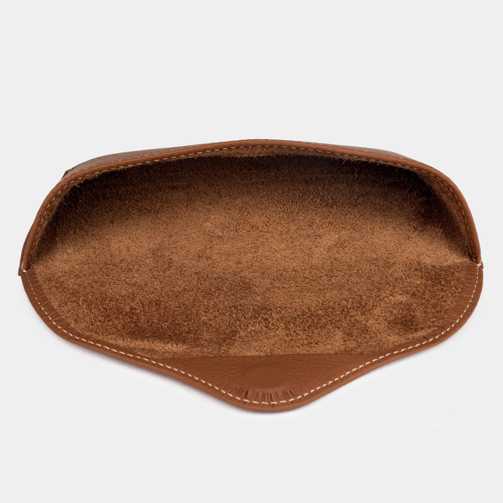 Inside the gold calfskin Riviera sunglasses case: natural suede lining