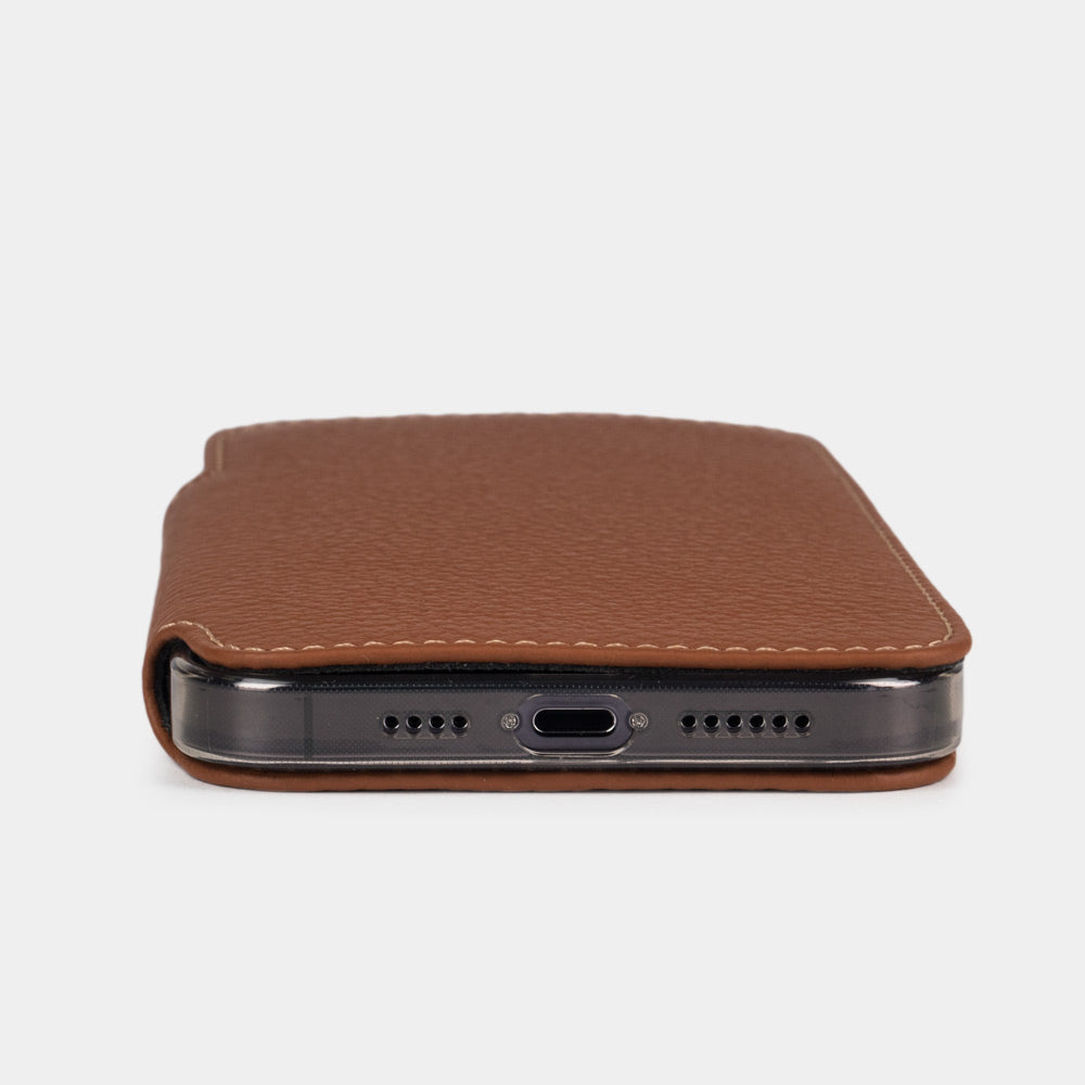 Gold calfskin leather folio case for iPhone 15 Pro – bottom edge with the port opening and speaker cutouts