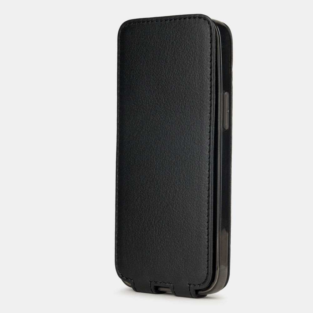 black leather iPhone 12 Pro flip case in an upright position, cover closes securely thanks to its integrated magnet system