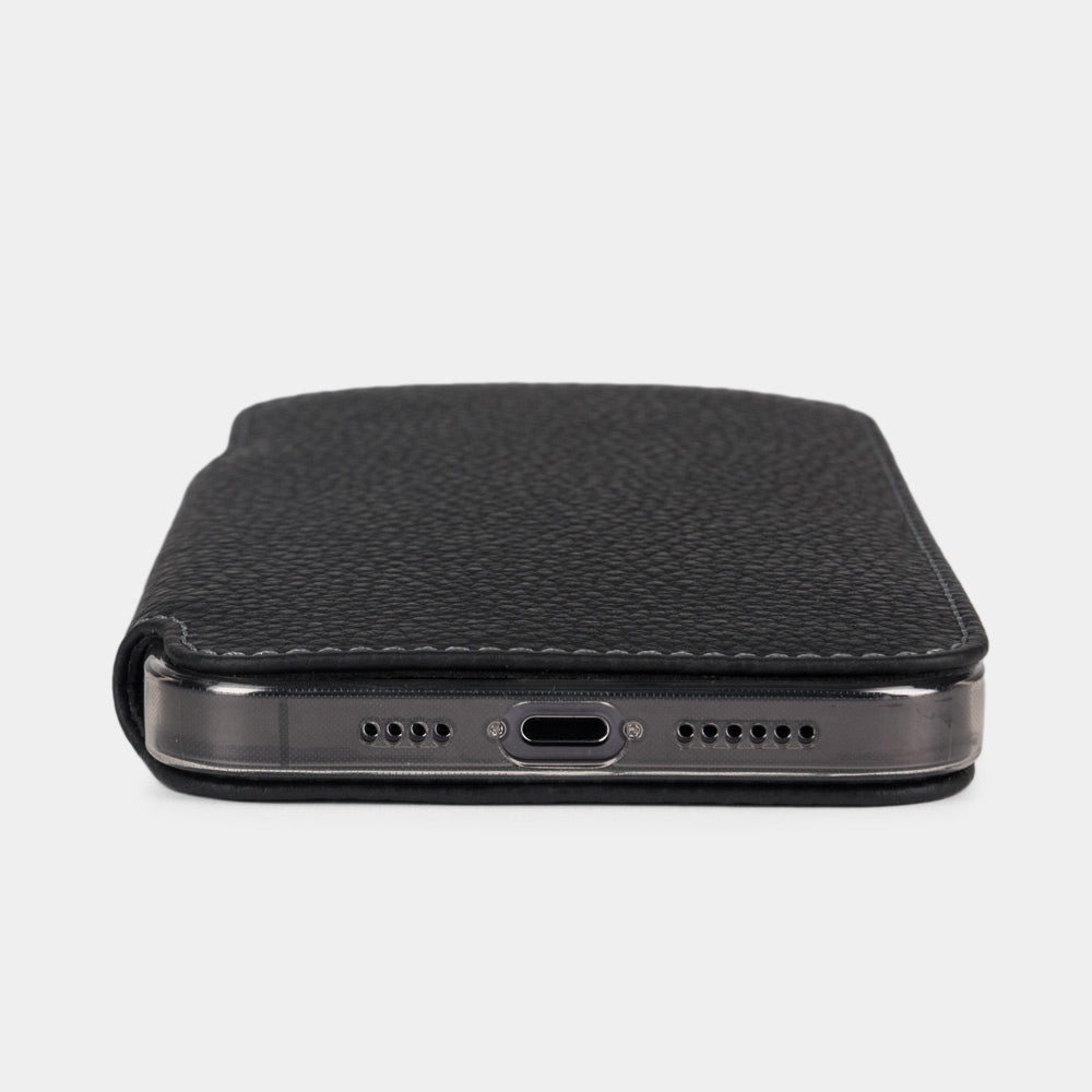 Black calfskin leather folio case for iPhone 15 Pro – bottom edge with the port opening and speaker cutouts