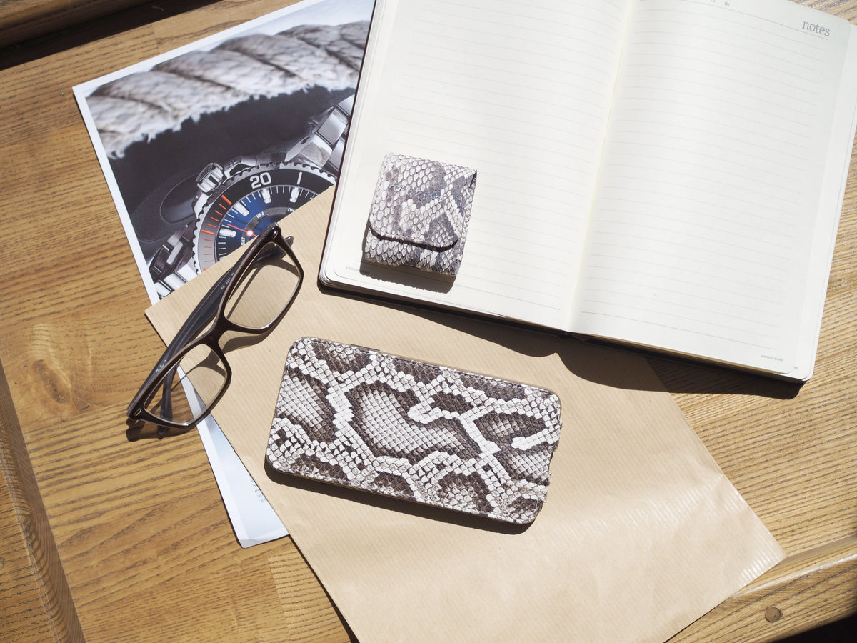 Natural python iPhone 14 Pro Max case, in hand